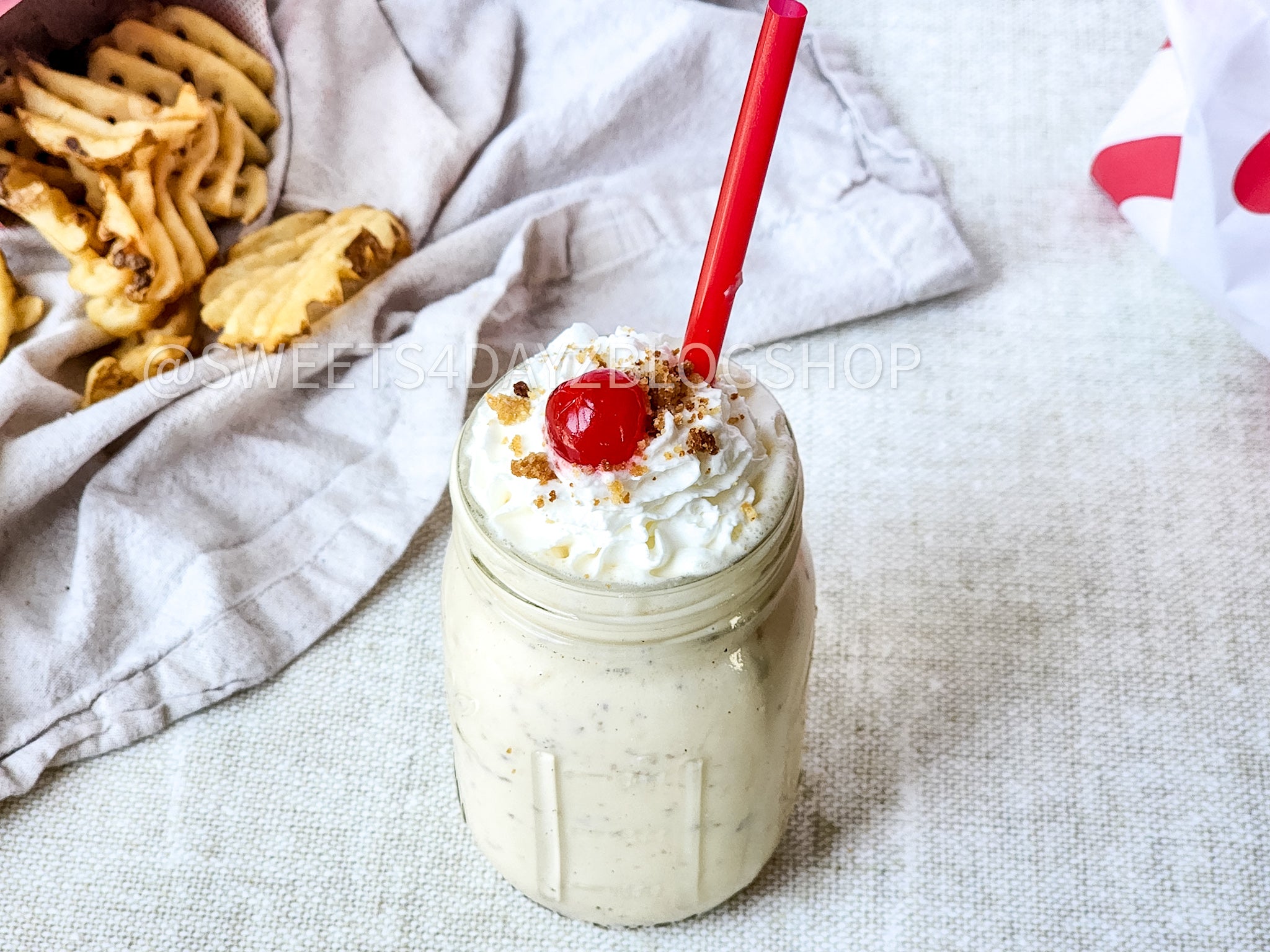 Copycat Chick Fil A Caramel Crunch Milkshake on Linen