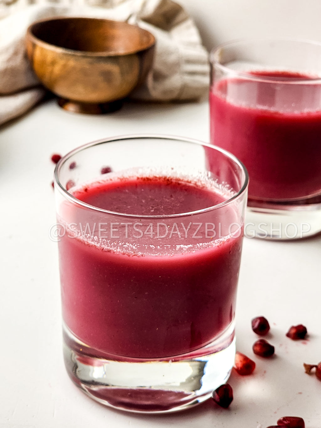 Homemade Pomegranate Juice on White