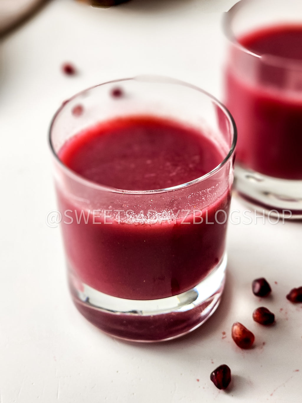 Homemade Pomegranate Juice on White