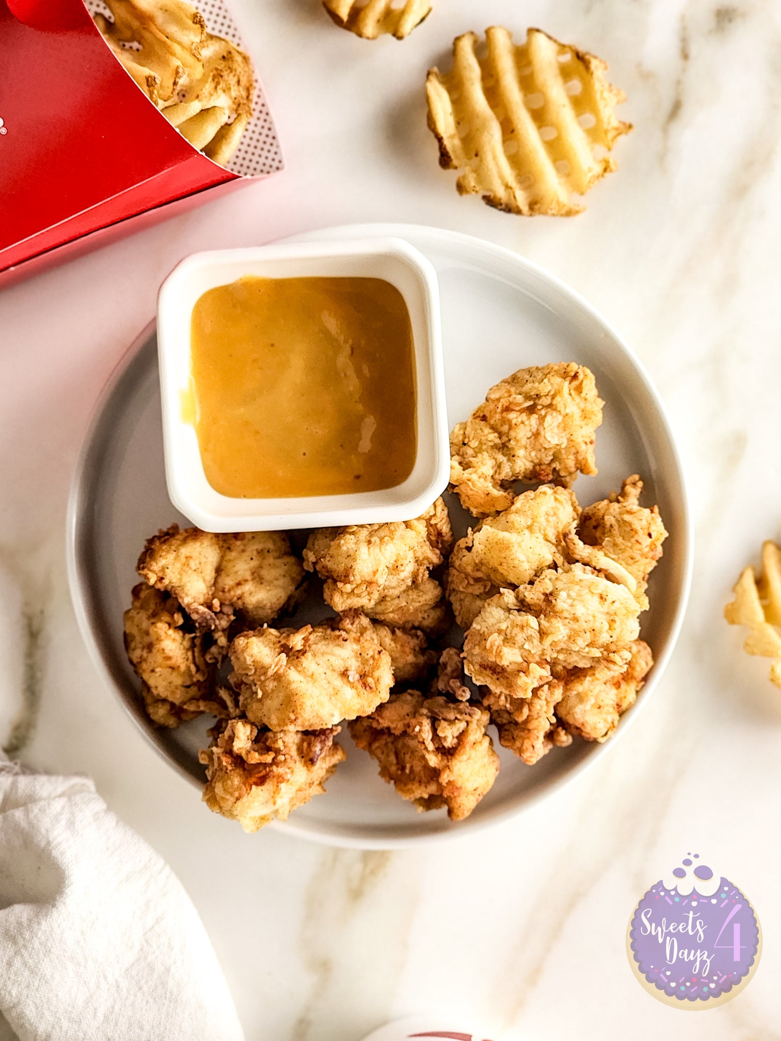 Copycat Chick Fil A Nuggets on Gold Marble