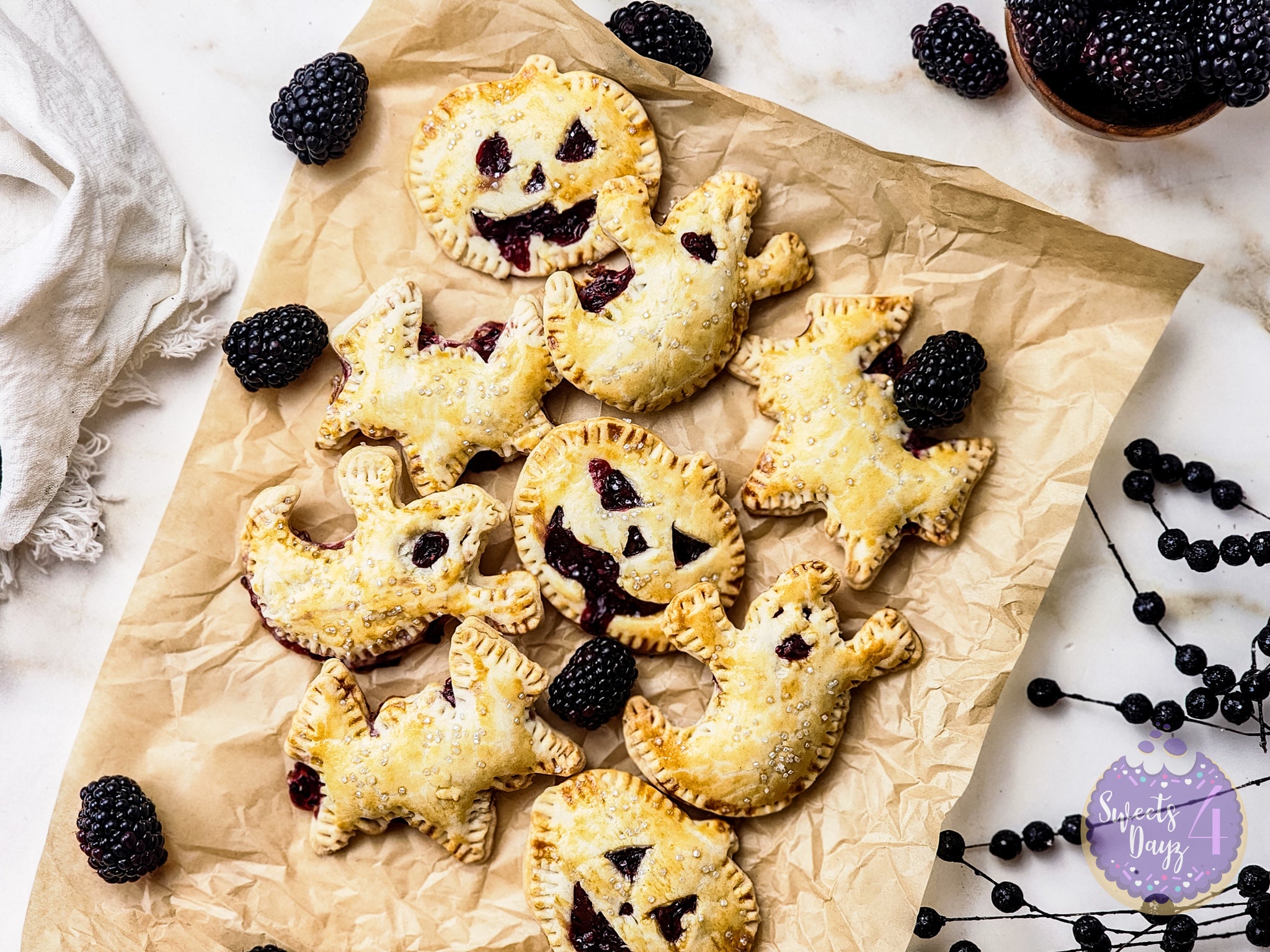 Spooky Fruit Hand Pies on Gold Marble