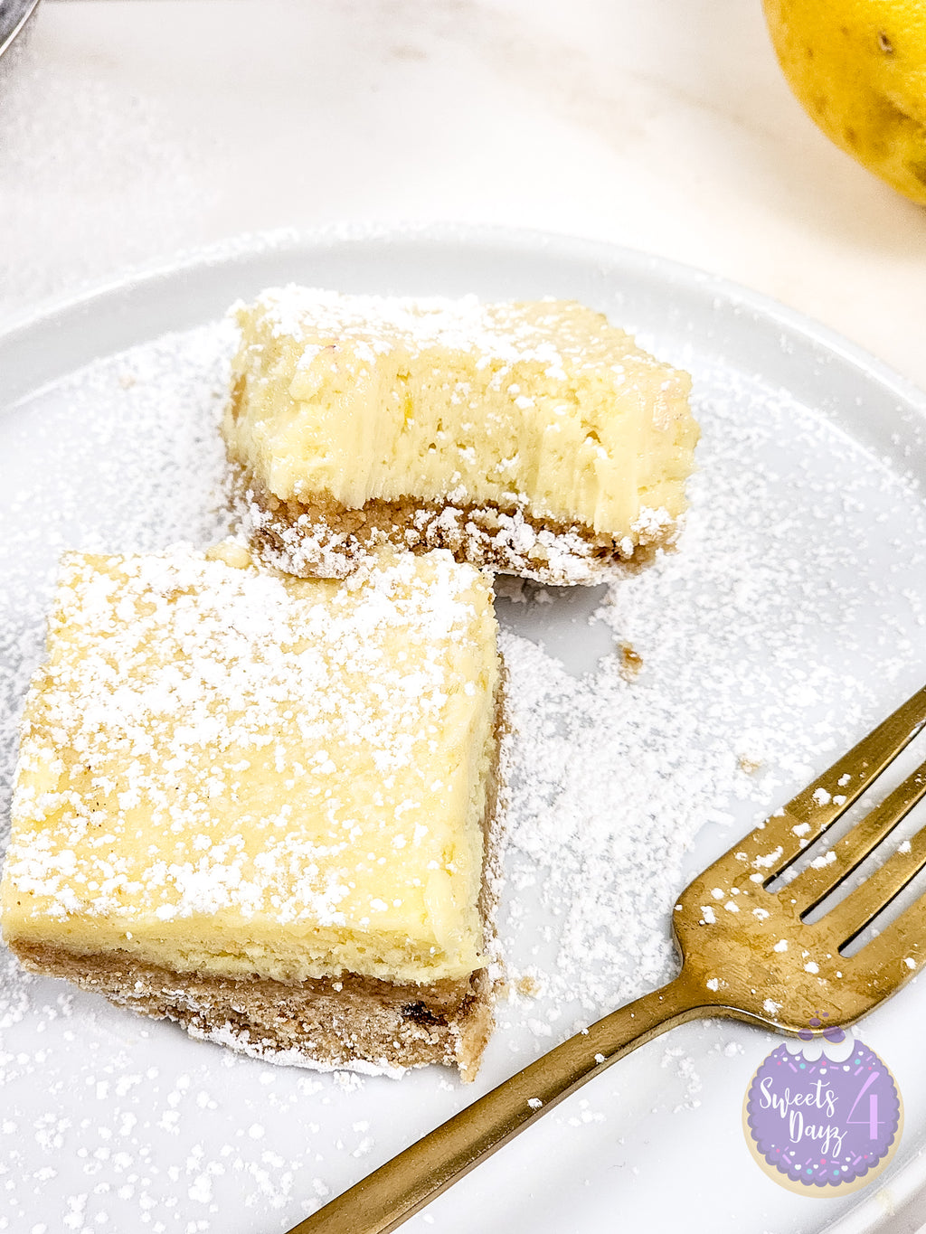 Lemon Cheesecake Bars on Gold Marble