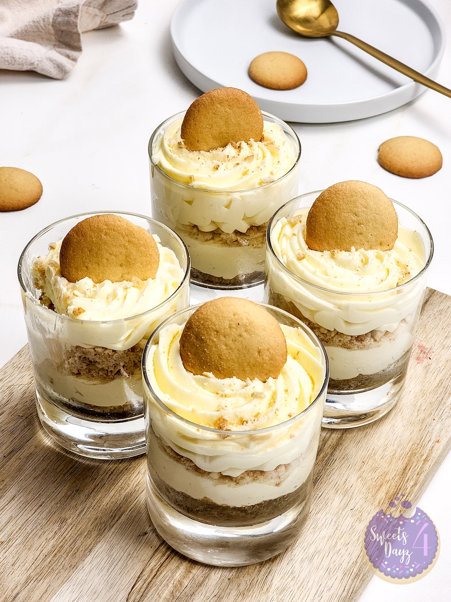 No Bake Vanilla Cheesecake Cups on Gold Marble