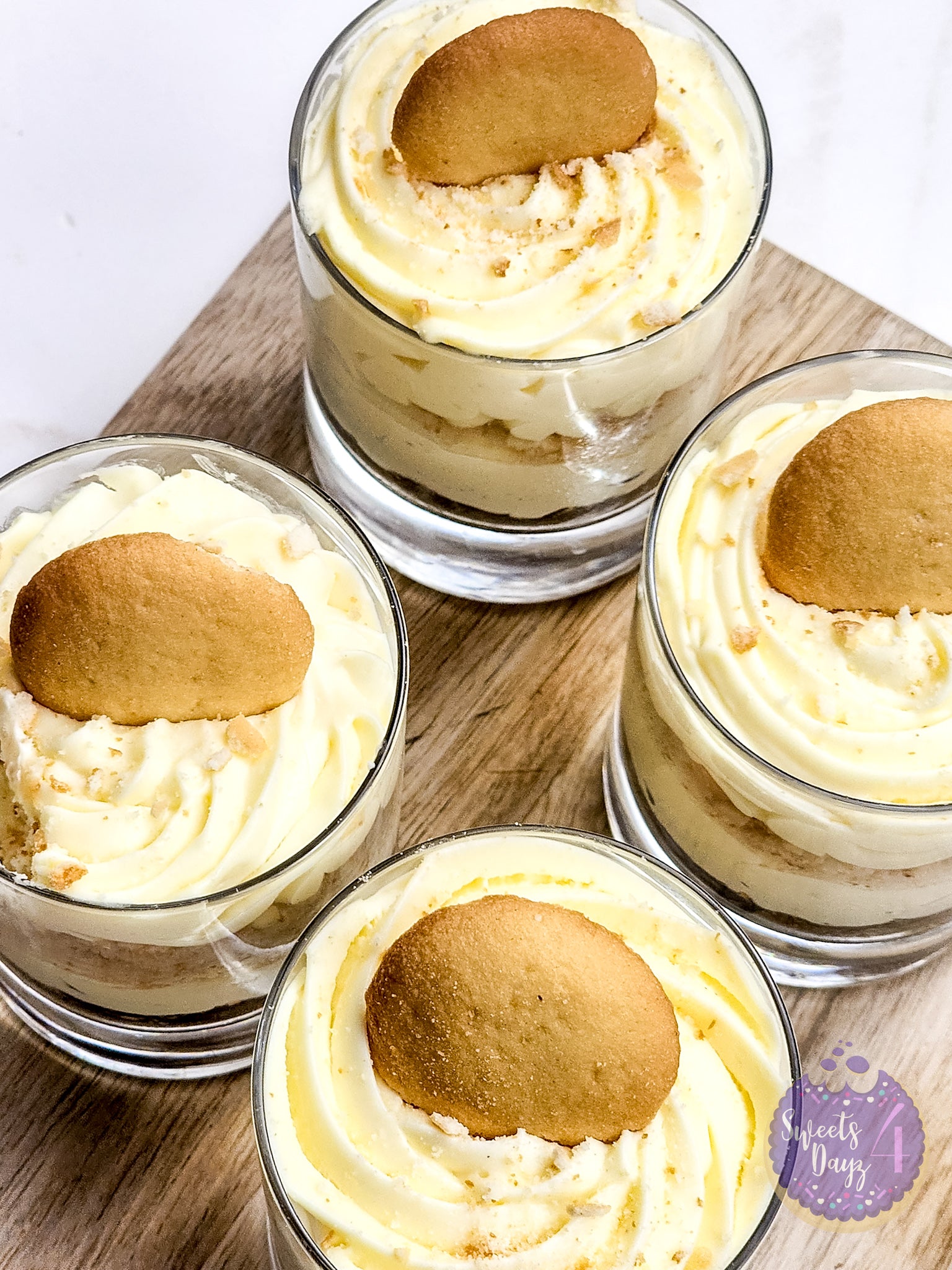 No Bake Vanilla Cheesecake Cups on Gold Marble